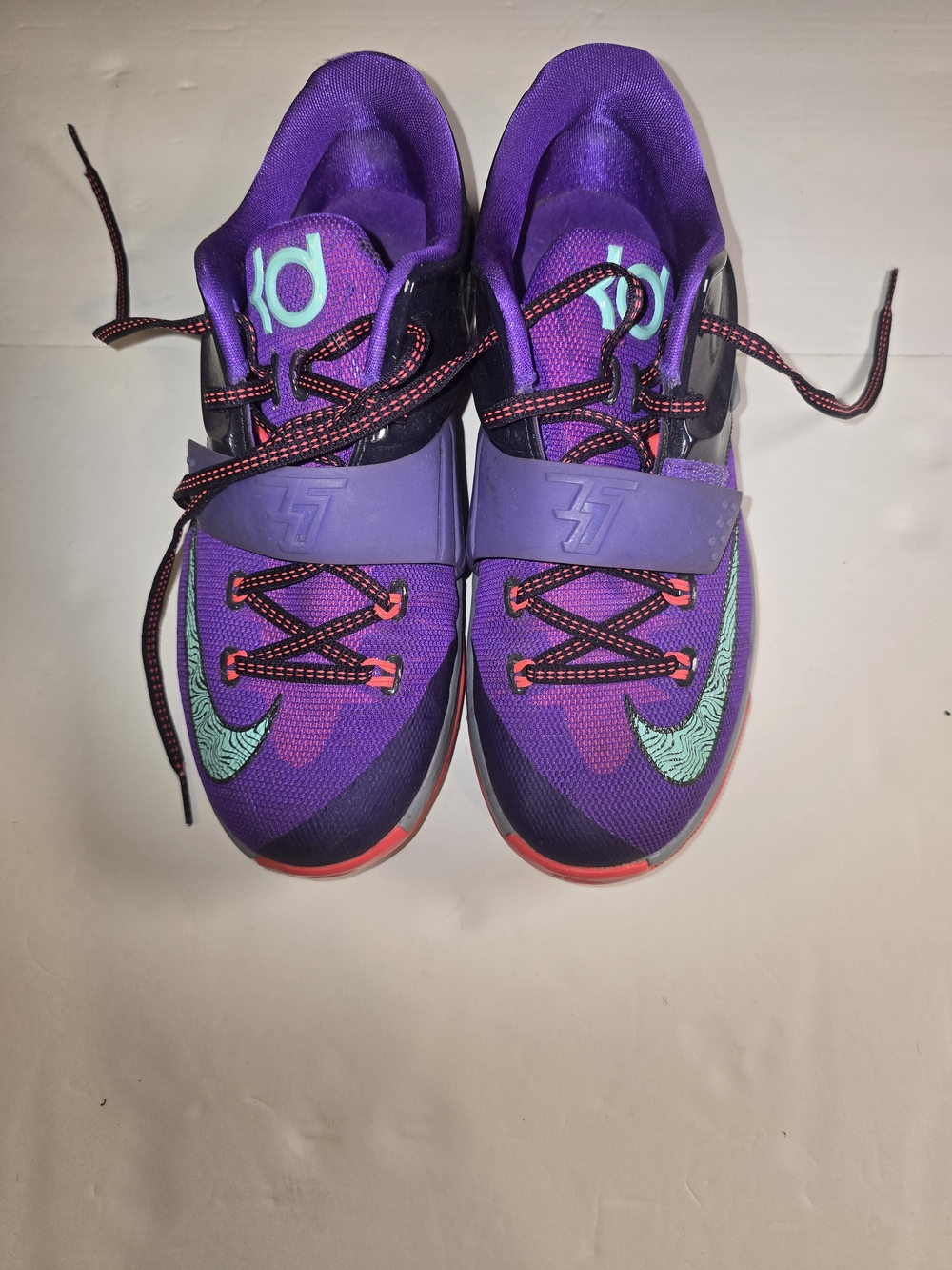 Nike Purple Basketball Shoes with Teal Swoosh and Red Accents